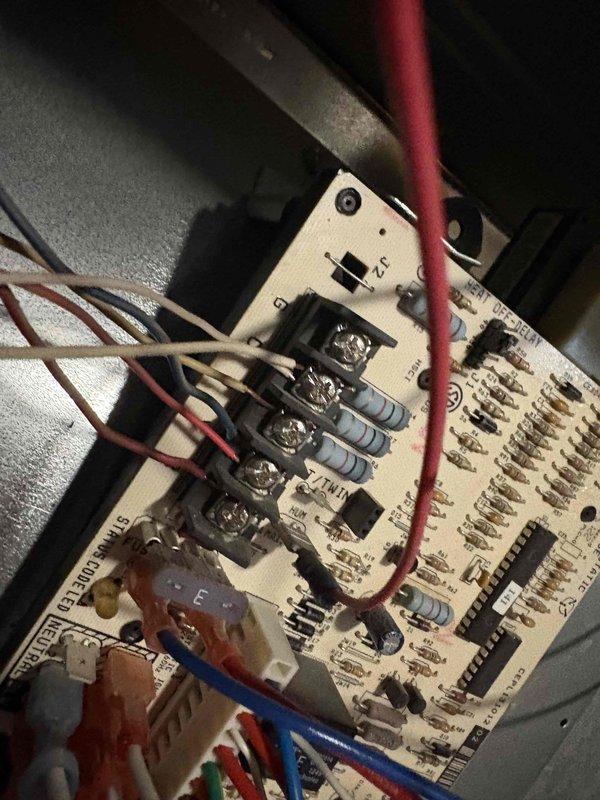 Performed comprehensive AC tune-up on a 10-year-old residential air conditioning system with no reported issues and confirmed proper operation. Inspected control board circuitry, terminal connections, and wiring integrity, verifying all electrical components functioning within normal parameters. Documented system condition through detailed photography of internal components and associated plumbing connections for maintenance records.