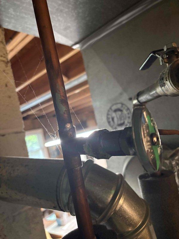 Performed comprehensive AC tune-up on a 10-year-old residential air conditioning system with no reported issues and confirmed proper operation. Inspected control board circuitry, terminal connections, and wiring integrity, verifying all electrical components functioning within normal parameters. Documented system condition through detailed photography of internal components and associated plumbing connections for maintenance records.