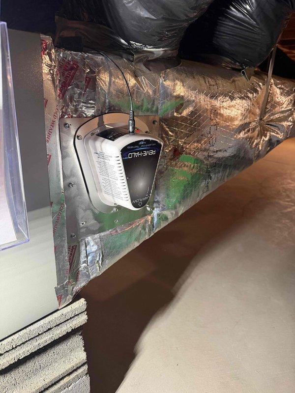 Returned to property to complete installation of REME HALO air purification system. Unit was successfully mounted and wired into the existing HVAC ductwork system. Verified proper electrical connections, confirmed operational status with indicator light illuminated, and ensured secure mounting within the air handler plenum for optimal whole-home air quality treatment.