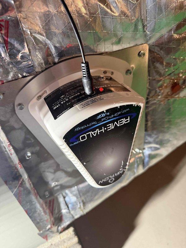 Returned to property to complete installation of REME HALO air purification system. Unit was successfully mounted and wired into the existing HVAC ductwork system. Verified proper electrical connections, confirmed operational status with indicator light illuminated, and ensured secure mounting within the air handler plenum for optimal whole-home air quality treatment.