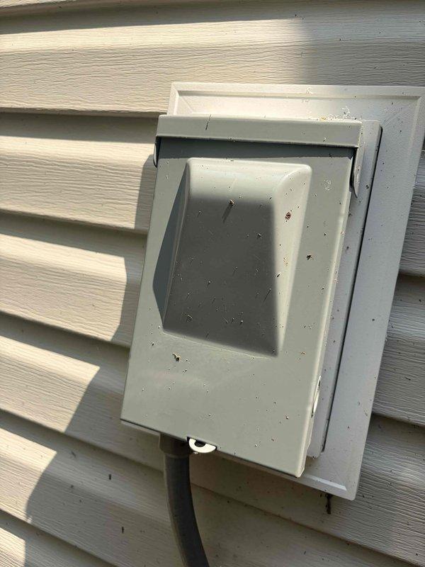 Completed routine cooling maintenance on air handler unit. Inspected and photographed Emerson control board showing all electronic components, indicator lights, and wiring connections in proper working condition. Verified outdoor disconnect and electrical connections at exterior receptacle.