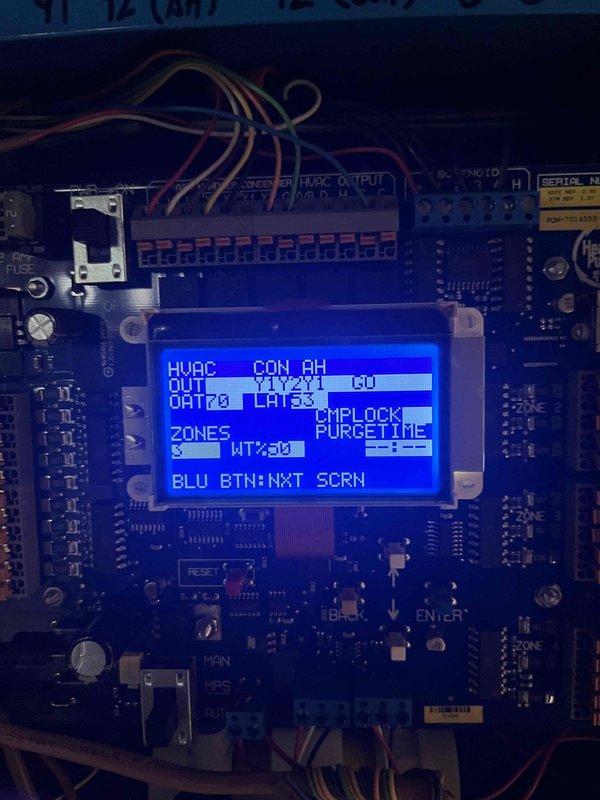 Responded to callback for mini split system that would not turn off after initial startup. Inspected THMS320R zone control module and associated HVAC control board. Verified proper wiring connections at terminal blocks and confirmed wireless connectivity status showing green "CONNECTED" indicator. Reviewed system configuration on control board LCD display showing air handler setup with zone controls and purge time settings. Diagnosed and resolved issue preventing system from responding to shutdown commands, restoring normal on/off operation functionality.