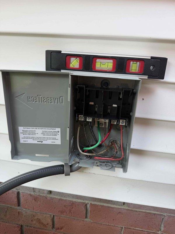 Completed full HVAC system installation as a return visit for previously sold equipment. Installed and leveled DiversiTech electrical disconnect boxes at both outdoor condenser and indoor air handler locations, ensuring proper alignment using torpedo level for code compliance. Terminated all electrical connections including line voltage wiring with appropriate color-coded conductors (black, red, white, and green ground wires) to disconnect switches, verified all connections were secure and properly torqued. Installed flexible conduit for electrical runs between disconnect boxes and equipment. Configured disconnect switches for proper service equipment operation and verified OFF position functionality. All electrical installations completed per manufacturer specifications and local electrical codes.
