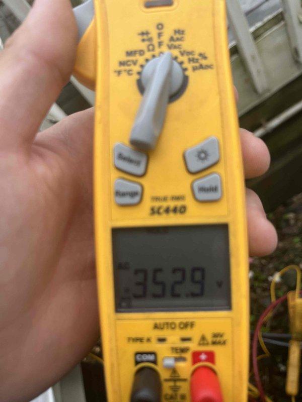 Responded to service call for air conditioning unit making banging noise during operation. Upon arrival, accessed unit through back entrance as directed. Performed diagnostic testing using digital multimeter, recording voltage reading of 352.9V at the outdoor condenser unit. Customer reported no maintenance performed on system since 2019. Inspected exterior condenser cabinet and louver panels, which showed normal physical condition with no visible damage or obstruction to airflow. Recommended scheduling comprehensive maintenance service to address deferred maintenance and investigate source of operational noise.