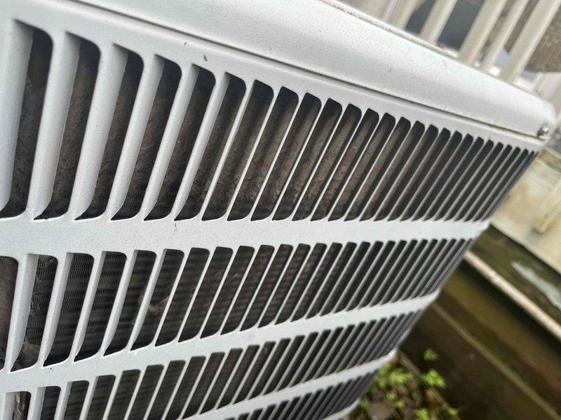 Responded to service call for air conditioning unit making banging noise during operation. Upon arrival, accessed unit through back entrance as directed. Performed diagnostic testing using digital multimeter, recording voltage reading of 352.9V at the outdoor condenser unit. Customer reported no maintenance performed on system since 2019. Inspected exterior condenser cabinet and louver panels, which showed normal physical condition with no visible damage or obstruction to airflow. Recommended scheduling comprehensive maintenance service to address deferred maintenance and investigate source of operational noise.