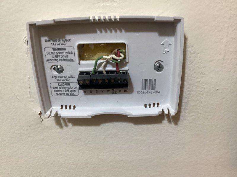 Responded to service call for 30-year-old oil boiler system reported as not operational. Upon arrival, performed diagnostic assessment of heating system including inspection of thermostat wiring and control configuration. Documented existing Honeywell digital thermostat installation and verified terminal connections at R, RC, W, Y, G, O, and B positions with corresponding colored wiring. Provided estimate for necessary repairs to restore heating system functionality.