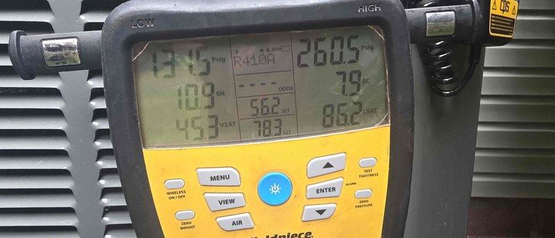 Completed HVAC maintenance club visit and enrollment. Performed system diagnostics using digital manometer to measure static pressure reading of +0.74 inches water column. Utilized multi-function digital analyzer to assess airflow parameters and temperature differentials across the system. Documented equipment conditions and readings with photographs for service records.