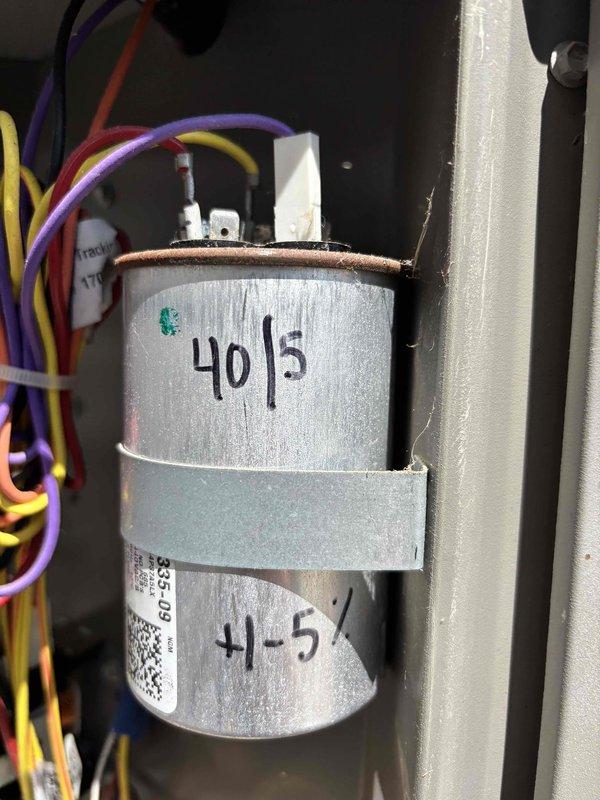 Completed cooling maintenance club visit on system prior to customer's extended travel. Inspected dual-run capacitor showing 40/5 MFD rating with visible corrosion on terminal assembly and upper rim; documented condition with photos. Measured and recorded compressor amperage at 3.58A using digital multimeter to verify system performance within acceptable operating parameters.