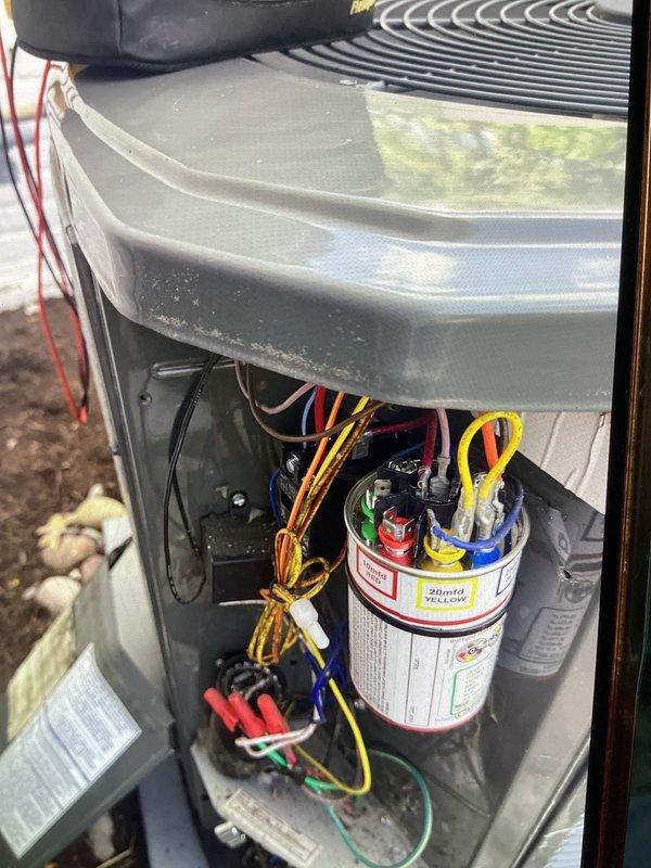 Performed cooling maintenance on upstairs air handler that was struggling to maintain temperature during extreme heat conditions. Inspected electrical components using clamp meter, verified capacitor connections and wiring integrity, and assessed internal control system components with access panel removed for thorough evaluation.