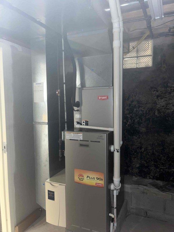 Responded to service call for second opinion on no-cooling complaint with frozen refrigerant line. Upon arrival, performed diagnostic evaluation of Bryant Plus 90t system. Conducted static pressure testing using digital manometer, obtaining reading of +0.529 inches water column to assess airflow across evaporator coil. Determined frozen line condition was likely caused by restricted airflow rather than low refrigerant charge as previously suspected. Recommended allowing system to thaw completely and addressing potential airflow restrictions including dirty air filter, blocked return air pathways, or blower motor issues before proceeding with refrigerant testing.