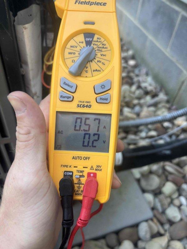 Completed cooling maintenance club visit and renewed membership plan. Performed system diagnostics using Fieldpiece SL640 meter to verify electrical readings and amperage draw, confirming proper operation. Inspected air filtration system and documented clean filter condition with adequate airflow.