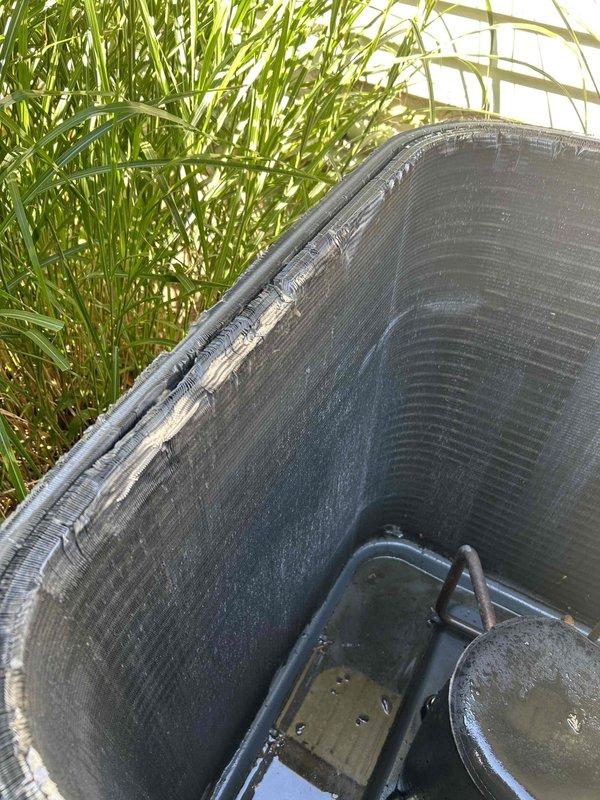 Returned to property to complete previously sold repair work on outdoor condensing unit. Upon arrival, found unit heavily soiled with accumulated dirt, debris, algae growth, and biological matter covering exterior surfaces and coil fins. Performed thorough cleaning of condenser cabinet, removing organic buildup, moss, and environmental contamination from all exterior panels. Cleaned condenser coil to restore proper airflow and heat transfer efficiency. Cleared vegetation and debris from around unit perimeter to ensure adequate clearance for proper operation and serviceability. Verified unit operational following cleaning procedures.