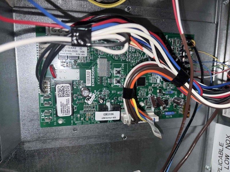 Completed cooling maintenance club visit on HVAC system. Performed electrical diagnostics using digital multimeter, recording voltage readings of 112V AC and verifying proper electrical parameters throughout the system. Inspected control board assembly and wiring connections within the equipment housing, confirming all circuit boards, components, and wire terminations were secure and functioning properly.