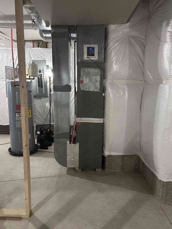 Performed comprehensive tune-up service on residential HVAC system located in basement mechanical room. Inspected air handler unit, ductwork connections, and overall system operation to ensure optimal performance and efficiency. System found to be in good working condition with all components functioning properly.