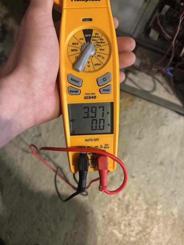 Completed cooling maintenance club visit on air handler unit. Performed electrical diagnostics using digital multimeter, recording voltage readings of 5.23V and 397V at various system components to verify proper electrical operation. Inspected outdoor and indoor equipment, tested capacitor function showing 0.0 MFD reading, and documented system performance through diagnostic measurements to ensure unit operating within manufacturer specifications.