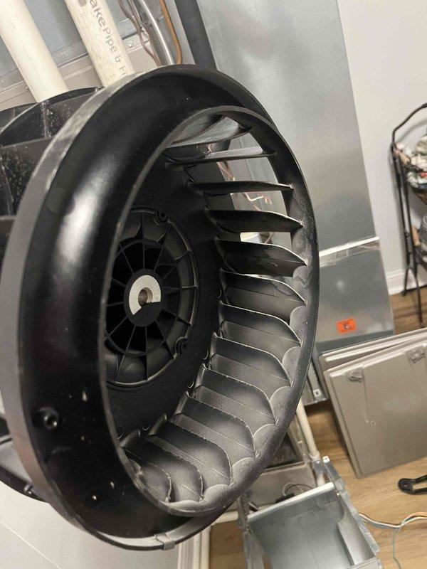 Returned to complete blower wheel cleaning as scheduled. Removed heavily soiled blower wheel assembly from air handler unit, which showed significant accumulation of dust and debris on blades and interior surfaces. Thoroughly cleaned blower wheel, removing all buildup to restore proper airflow and system efficiency, then reinstalled component and verified proper operation.