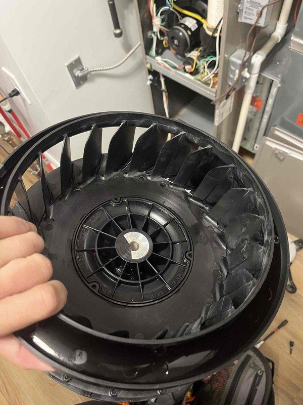 Returned to complete blower wheel cleaning as scheduled. Removed heavily soiled blower wheel assembly from air handler unit, which showed significant accumulation of dust and debris on blades and interior surfaces. Thoroughly cleaned blower wheel, removing all buildup to restore proper airflow and system efficiency, then reinstalled component and verified proper operation.