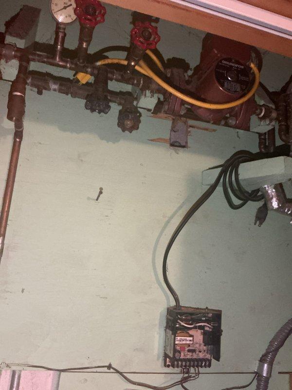 Conducted comprehensive inspection of legacy plumbing system in 1985-built home, focusing on obsolete well water piping infrastructure located in basement utility areas. Evaluated condition of aged copper supply lines, hydronic heating components including circulator pump assemblies, gate valves with decorative wheel handles, pressure gauges, and associated pipe configurations across multiple wall-mounted runs. Assessed visible corrosion, oxidation patterns, and overall integrity of existing copper piping showing typical age-related deterioration. Documented plumbing closet locations and existing pipe routing to advise on removal or modernization options in conjunction with planned remodel of older room. Provided homeowner with professional recommendations for updating antiquated plumbing infrastructure, including options for abandoning unused well water supply lines, consolidating pipe runs, and eliminating unnecessary fixtures to optimize space utilization during renovation project.