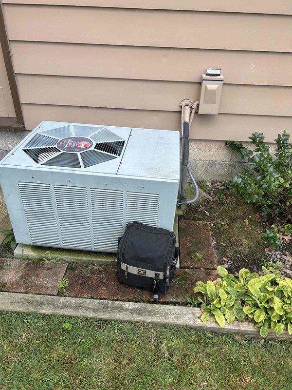 # Emergency No Cooling Call - 25-Year-Old System

Responded to emergency service call for complete loss of cooling on residential air conditioning unit approximately 25 years old. Upon arrival, performed visual inspection of outdoor condensing unit and electrical components. Opened electrical junction box to assess wiring connections and capacitor condition. Found system with significant age-related wear, corrosion on electrical enclosure, and accumulated dirt and debris throughout cabinet and electrical compartment. Documented equipment condition with photographs showing weathered components, rust staining on junction box interior, and general deterioration consistent with unit age. Inspected capacitor, contactor assembly, and wire connections for signs of failure. Evaluated overall system condition and serviceability given advanced age of equipment. Provided assessment and recommendations to customer regarding repair versus replacement options for aging unit that has exceeded typical