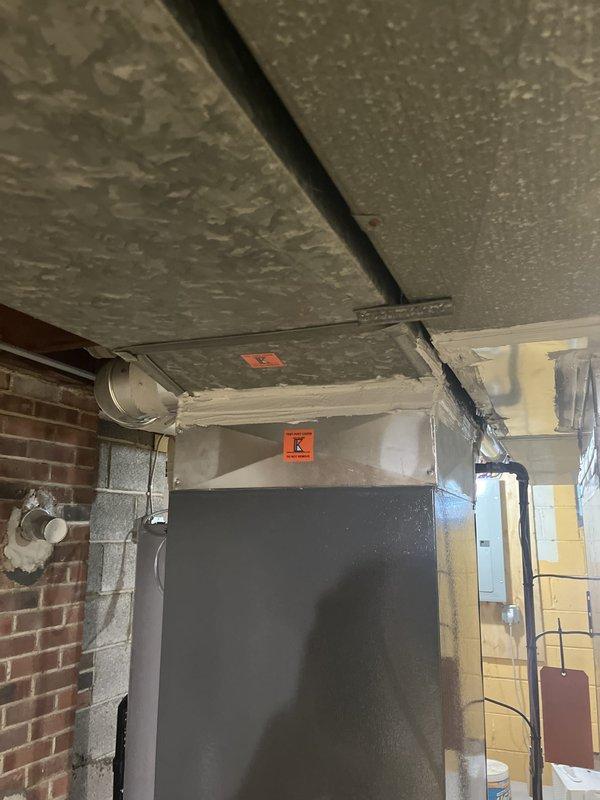 Completed full HVAC system installation at residential property. Installed new heating and cooling equipment including air handler and condensing unit, routed refrigerant lines and condensate drainage, and integrated T10 thermostat with remote sensor for optimal temperature control. Required drilling through brick exterior wall to accommodate line set penetration and proper equipment placement. Protected work areas with drop cloths throughout kitchen and basement spaces during installation. All equipment commissioned, tested for proper operation, and system confirmed functioning to manufacturer specifications.