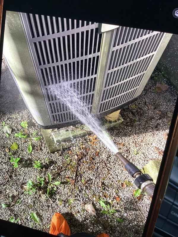 Performed comprehensive cooling maintenance on two air handler units as part of membership club visit. Inspected Aprilaire air filtration system and verified proper airflow direction and filter specifications on unit 210. Cleaned outdoor condenser coils using high-pressure water spray to remove debris accumulation and restore optimal heat transfer efficiency, ensuring both systems are operating at peak performance for the cooling season.