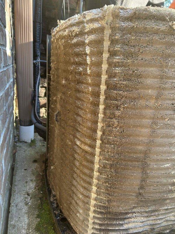 Returned to property to perform two outdoor condenser coil cleanings as previously sold. Upon arrival, found both outdoor units with heavy accumulation of dust, dirt, and fibrous debris significantly restricting airflow through the condenser coils. The buildup was dense enough to obscure the fin structure and compromise heat transfer efficiency.

Performed thorough coil cleaning on both units using appropriate cleaning solutions and techniques to remove all accumulated contamination. Restored proper airflow through condenser fins and verified coils were clean and clear of obstructions. System operational and running efficiently upon completion of service.