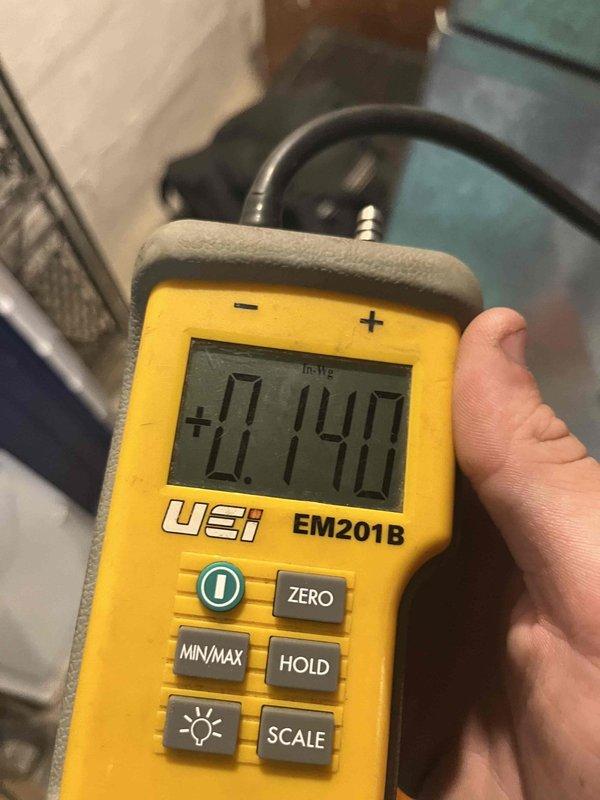 Completed cooling maintenance club visit on residential HVAC system. Performed standard diagnostic measurements including static pressure readings using digital manometer, which indicated +0.140 inches of water gauge. Measured supply air temperature at 56.1°F using calibrated digital thermometer to verify proper cooling operation and system performance within acceptable parameters.