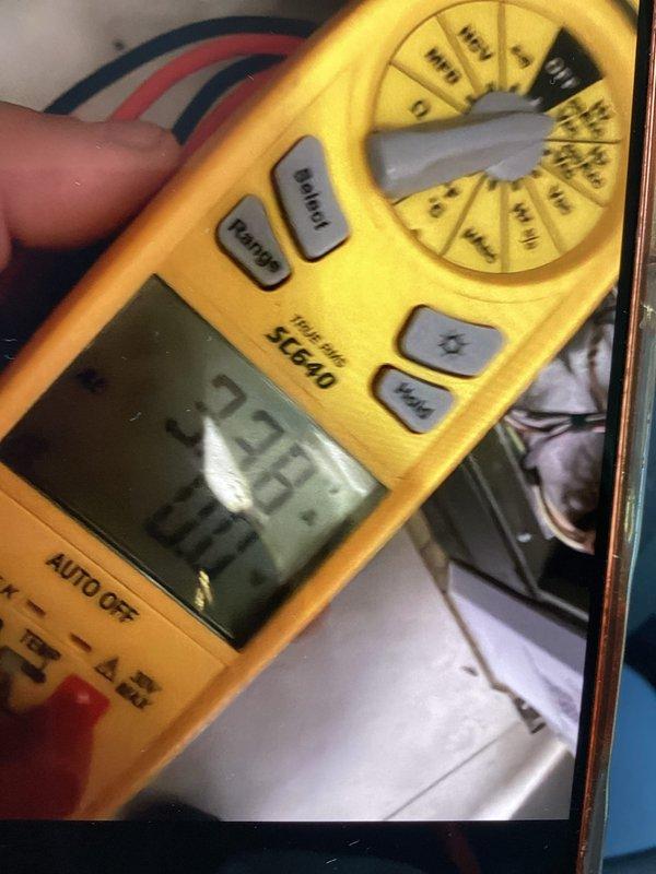 Completed scheduled maintenance plan visit and replaced air filter. Performed electrical diagnostics on HVAC system using digital multimeter, recording voltage readings of 223.7V and additional measurements of 102V and 23V to verify proper system operation and electrical component functionality.