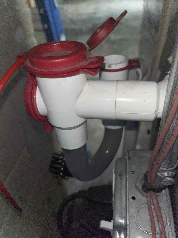 Completed scheduled cooling maintenance for club member's air handler system. Performed comprehensive inspection of condensate drain assembly, including safety float switch and PVC piping connections. Verified proper operation of overflow protection device with red safety switch mechanism. Checked condensate drain lines and black corrugated drain hose for blockages and proper flow. Measured supply air temperature at 55.9°F using calibrated digital thermometer, confirming adequate cooling performance. All components operating within normal parameters. System running efficiently with no issues identified.