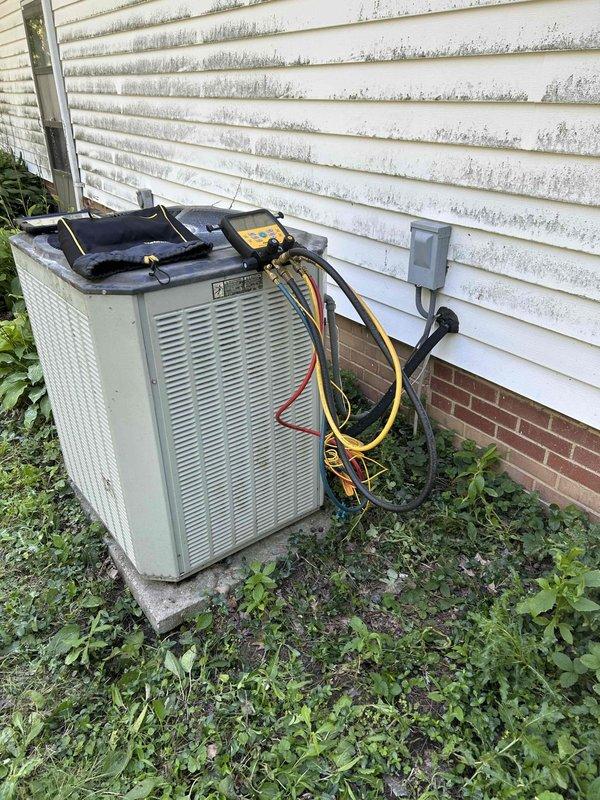 Responded to no cooling complaint on residential air conditioning system. Upon arrival, found unit partially disassembled by homeowner during attempted cleaning. Reassembled outdoor condenser unit, verified proper electrical connections, and performed system diagnostics using refrigerant manifold and micron gauge. Checked system pressures, temperatures, and superheat/subcooling values to confirm proper refrigerant charge and system operation. Unit restored to normal cooling operation with all readings within manufacturer specifications.