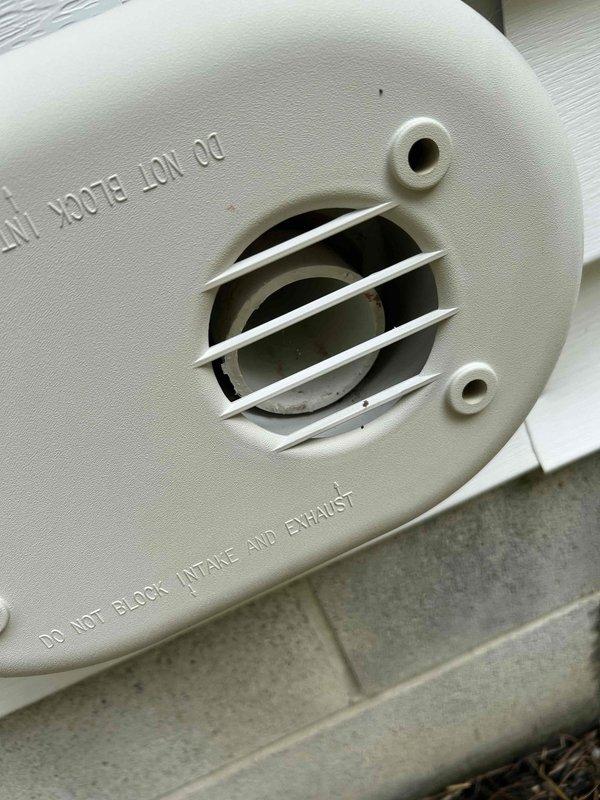 # HVAC Service Report

Responded to emergency no-cooling call on eight-year-old residential air conditioning system. Upon arrival, performed visual inspection of outdoor condensing unit and verified proper airflow through intake and exhaust vents. Inspected electrical connections at junction box, confirmed secure conduit connections and proper power supply to unit. Verified all mechanical components accessible during exterior inspection were properly mounted and operational. Documented equipment condition with photographic evidence showing intake/exhaust vent assembly with unobstructed airflow passages and electrical junction box with dual outlets and metallic conduit connections in good working order.