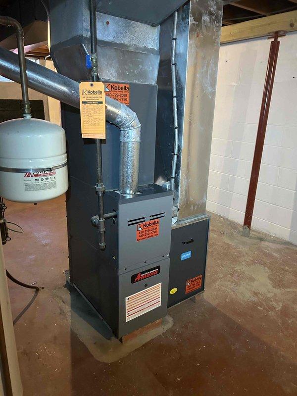 Completed comprehensive tune-up and system evaluation on residential HVAC equipment, including indoor furnace unit located in basement mechanical room and outdoor condenser unit. Performed full inspection of heating and cooling components, verified proper operation of both systems, and documented equipment condition with detailed photographic records for service history.