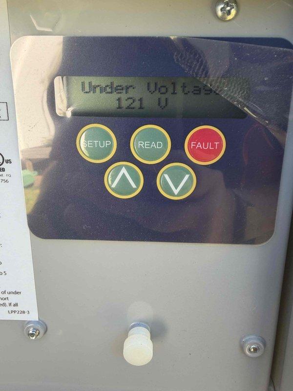 Completed cooling maintenance club visit on residential HVAC system. Performed comprehensive system diagnostics including electrical measurements, recording 467V AC current draw and 0.3A operating amperage using digital clamp meter. Inspected control panel which displayed under voltage condition at 121V, indicating potential power supply issue requiring monitoring. Documented equipment conditions with photos showing outdoor condensing unit components, electrical connections, and control interface readings. System operational at time of departure with voltage anomaly noted for future reference.
