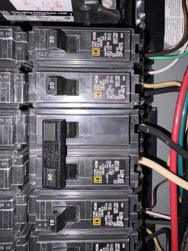 Conducted comprehensive site assessment for HVAC system replacement estimate. Documented existing electrical infrastructure including main distribution panel with Square D circuit breakers and residential thermostat wiring configuration showing standard four-wire setup (R, Y, W, G terminals). Gathered information regarding current heating and cooling system type, age, operational status, and confirmed presence of multiple units to determine appropriate replacement specifications and electrical requirements for new equipment installation.