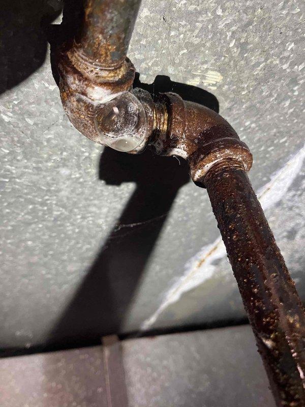 Responded to gas leak emergency where utility company had shut off gas supply at the meter. Upon arrival, conducted thorough inspection of gas piping system and identified severely corroded gas line fittings with extensive rust deterioration, pitting, and mineral deposits at threaded connections. The advanced corrosion posed significant safety risk and was determined to be the source of the gas leak. Performed pressure test on the gas system using calibrated pressure gauge, which confirmed system integrity issues related to the compromised piping. Documented all corroded components and test results with photographs for service records and future reference.