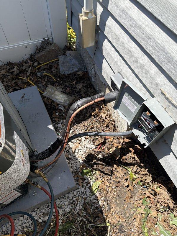 Completed full HVAC system installation including outdoor condensing unit with proper electrical disconnect, refrigerant line set with insulation, and condensate drain piping. Verified electrical connections, leveled equipment, and ensured all components were properly secured and operational per manufacturer specifications.