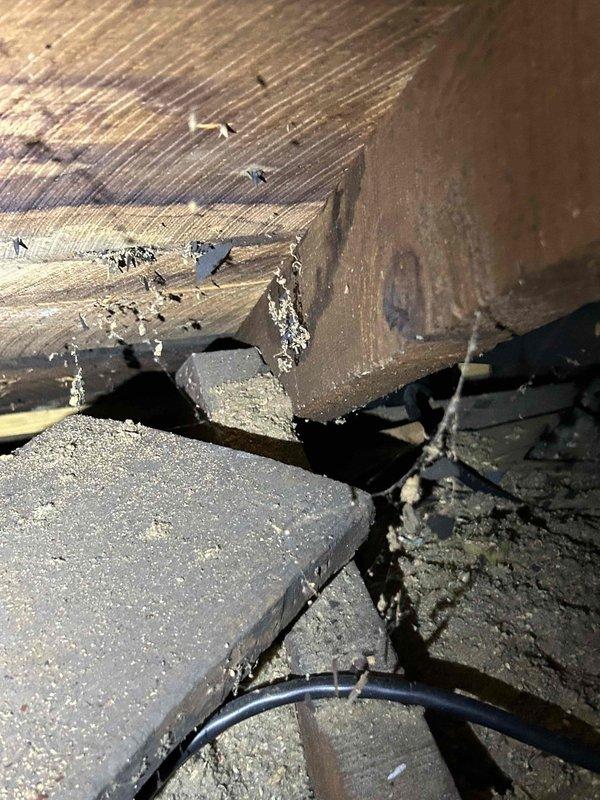 Responded to water leak complaint originating from 7-year-old mini-split system penetrating through interior wall. Upon inspection, identified condensate drainage issue causing moisture infiltration into wall cavity. Inspected indoor air handler unit mounted in upper-floor room, examined condensate drain line routing, and traced leak source to compromised drain connection or blockage. Cleared condensate line obstruction, verified proper drainage flow, and confirmed system operation. Documented existing conditions showing mini-split installation and structural areas affected by water intrusion for customer records.