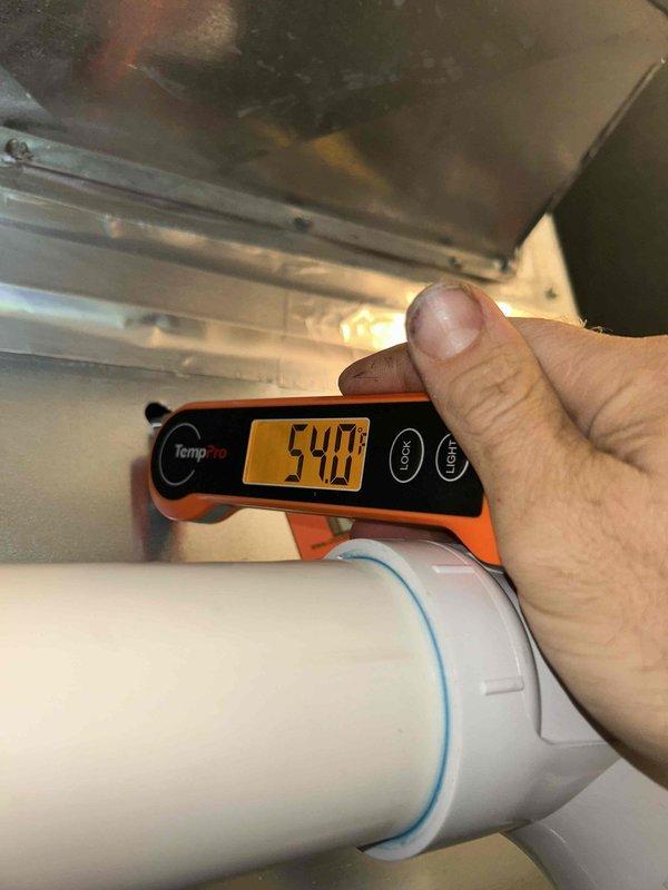 Completed cooling maintenance club visit on upstairs air handler unit. Identified defective two-inch 90-degree elbow on furnace exhaust requiring replacement. Installed new 90-degree elbow fitting with two couplings on PVC exhaust line. Verified proper exhaust temperatures using infrared thermometer and confirmed system electrical readings with multimeter. All repairs completed under warranty coverage.