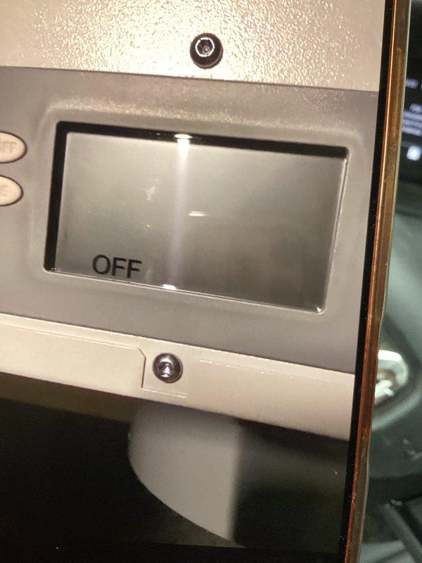 Responded to callback for newly installed dehumidifier displaying E5 error code (high temperature thermistor fault at compressor outlet). Performed power cycle of unit and conducted diagnostic troubleshooting of thermistor circuit and compressor discharge temperature sensor. Verified unit returned to normal operation, displaying 67% RH and actively dehumidifying. Documented equipment status with photos showing control interface in OFF mode and unit successfully running in dehumidifying cycle.