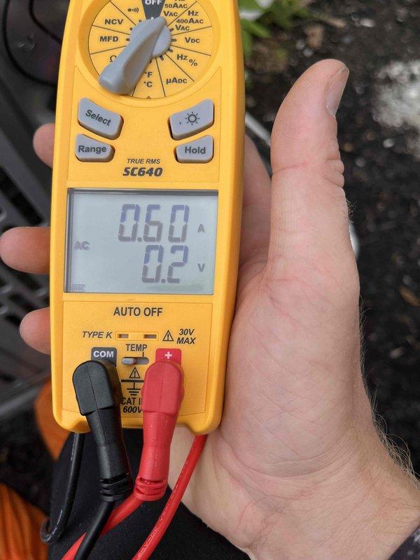 Completed scheduled cooling maintenance member visit. Performed diagnostic testing of HVAC system using digital multimeter, recording temperature readings of 68.1°F and electrical measurements showing 0.60 amps and 0.2 volts at various test points to verify proper system operation and component functionality.