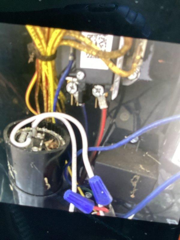 Completed routine air conditioning maintenance and club visit inspection. Performed electrical system diagnostics using digital multimeter to verify proper voltage and capacitor function, inspected internal wiring connections and control components, and documented equipment condition with photos. All electrical connections, capacitor, and control circuits found to be operating within normal parameters.