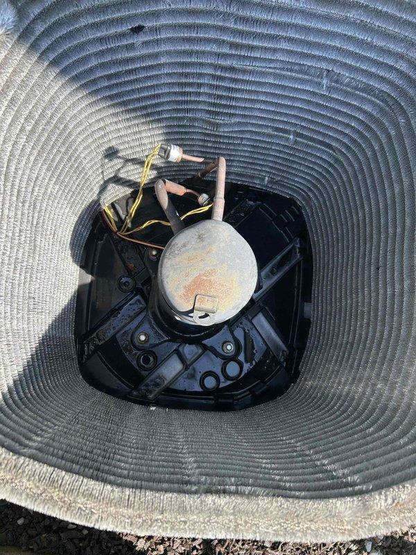 Returned to property to perform sold repair service consisting of outdoor coil cleaning and indoor coil treatment. Upon arrival, found outdoor condenser unit heavily contaminated with dust, lint, and environmental debris accumulation on coil fins, significantly restricting airflow and reducing heat transfer efficiency. Thoroughly cleaned outdoor condenser coil to remove all built-up debris and restore proper airflow through heat exchanger. Applied rinse-free coil cleaner to indoor evaporator coil to remove biological growth, dust accumulation, and improve system performance. Unit capacitor showed signs of weathering and corrosion but remained functional. Completed all cleaning procedures as sold, restoring system to optimal operating condition.