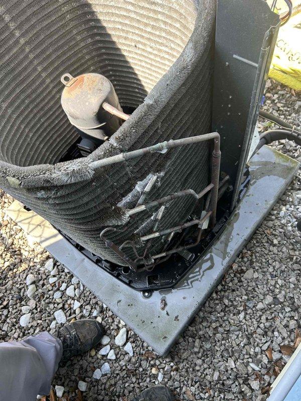 Returned to property to perform sold repair service consisting of outdoor coil cleaning and indoor coil treatment. Upon arrival, found outdoor condenser unit heavily contaminated with dust, lint, and environmental debris accumulation on coil fins, significantly restricting airflow and reducing heat transfer efficiency. Thoroughly cleaned outdoor condenser coil to remove all built-up debris and restore proper airflow through heat exchanger. Applied rinse-free coil cleaner to indoor evaporator coil to remove biological growth, dust accumulation, and improve system performance. Unit capacitor showed signs of weathering and corrosion but remained functional. Completed all cleaning procedures as sold, restoring system to optimal operating condition.