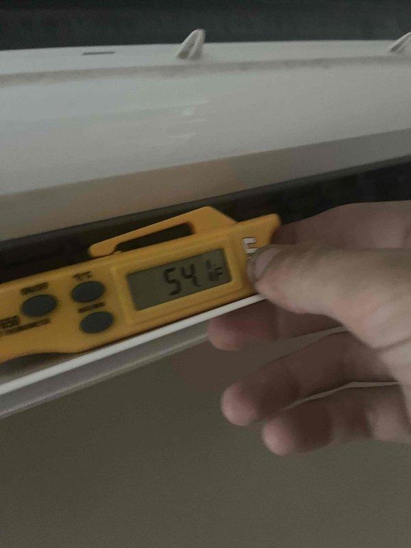 Responded to service call for leaking 10-year-old Mitsubishi Electric ductless mini-split air conditioning unit. Upon arrival, performed visual inspection of wall-mounted indoor unit and surrounding area. Conducted moisture measurement testing using digital meter, which indicated elevated moisture level of 54% at the unit location. Inspected drain line system, condensate pan, and refrigerant connections for source of water leak. Documented equipment condition and moisture readings with photos for service records.