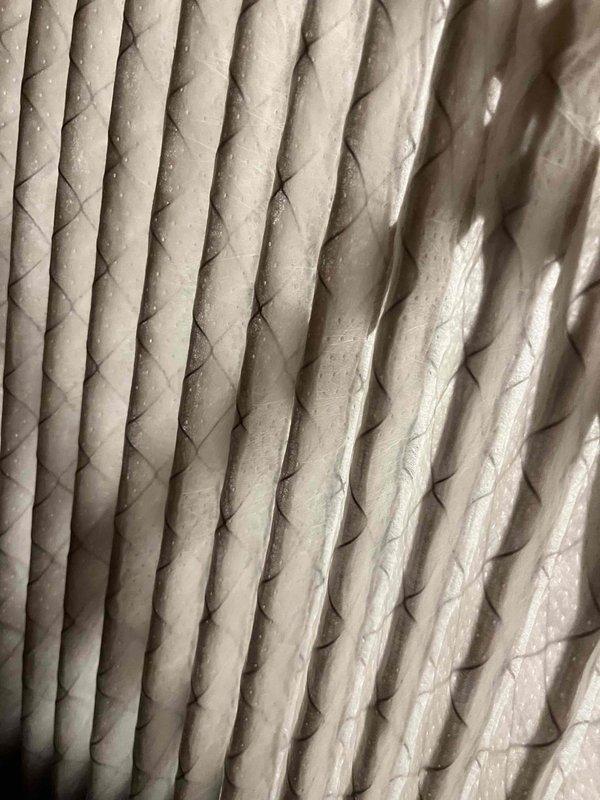 Completed scheduled AC tune-up and maintenance inspection during morning service window. System operating properly per customer report, with unit performing well as temperatures increase. Inspected air filtration system and documented filter condition showing normal dust accumulation on pleated media.