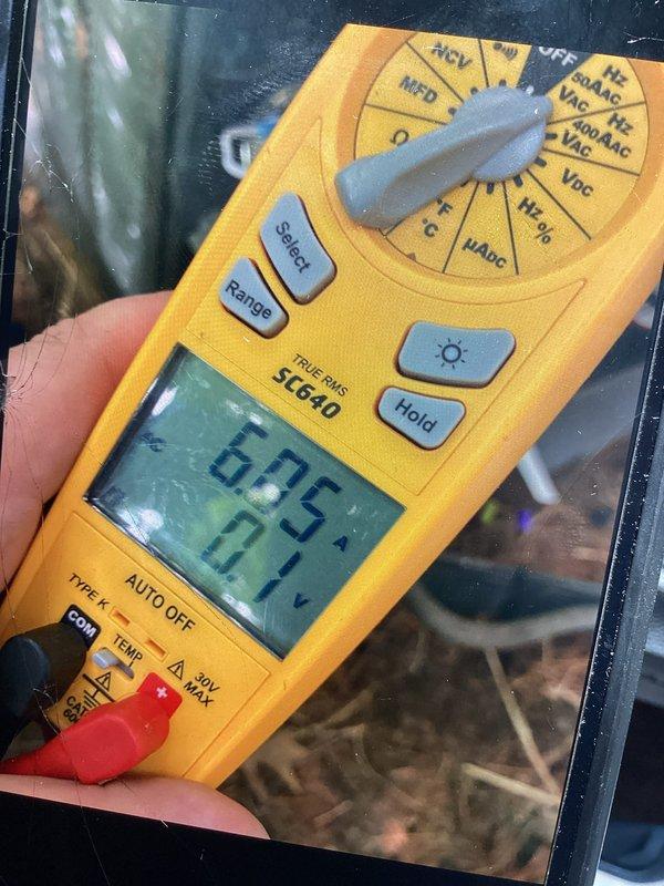 Replaced failed dual run capacitor and installed hard start kit on HVAC system to restore proper compressor operation. Performed complete system tune-up including electrical testing, which confirmed proper voltage and amperage readings at 6.05 on multimeter. All wiring connections secured and system returned to normal operating condition.