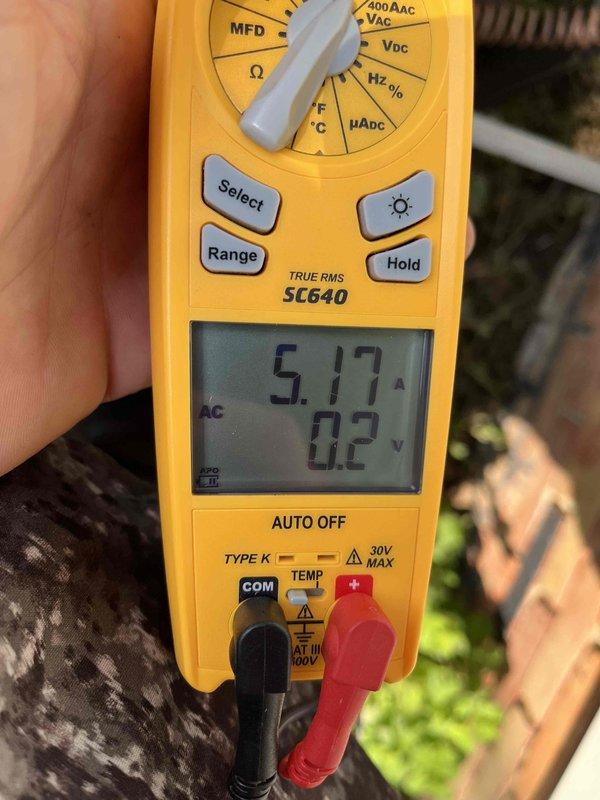 Completed cooling maintenance club visit on residential HVAC system. Performed comprehensive system inspection and diagnostics on Alumacoil-manufactured condensing unit model CA25A3H5TC4A4. Utilized TRUE RMS SC640 digital multimeter to measure and verify electrical parameters, recording amp draw of 5.17A and voltage reading of 0.2V during testing procedures. Verified manufacturer specifications and confirmed unit serial number 15002313822. All safety labels and installation notices were present and legible on equipment exterior. System operating within normal parameters upon completion of maintenance protocol.