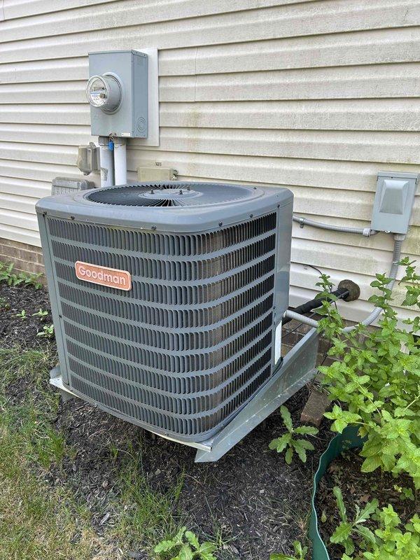 Performed comprehensive tune-up and inspection on Goodman outdoor condensing unit and indoor air handler system. Documented existing dust accumulation on interior components and verified proper electrical connections throughout system. All operational parameters checked and unit confirmed to be functioning within manufacturer specifications for continued reliable performance.