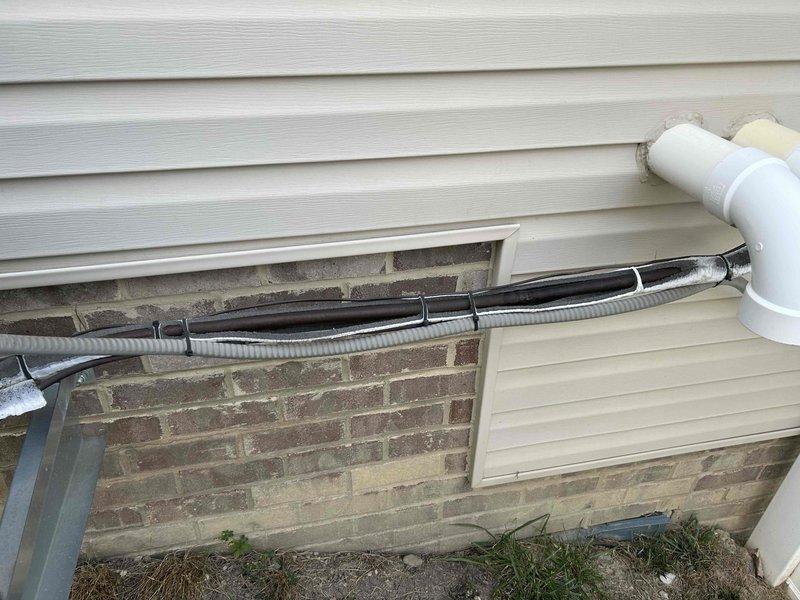 Completed annual tune-up and inspection on residential air handler unit. Performed standard maintenance procedures including filter check, electrical connections inspection, and verification of refrigerant line insulation integrity. All exterior components, including disconnect box and line set penetrations, were examined and found to be in proper working condition.