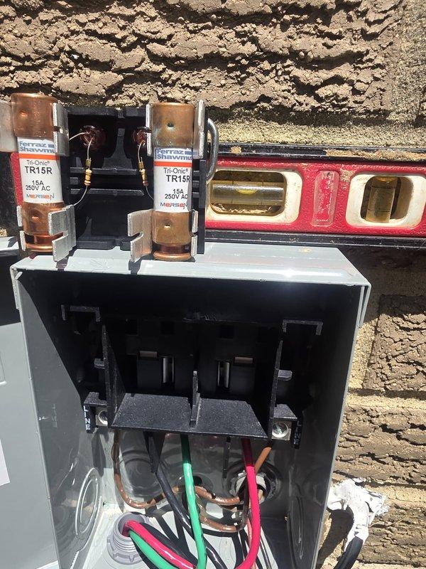 Completed full HVAC system installation including outdoor condensing units, electrical disconnect with proper fusing and leveling, refrigerant line sets, and system evacuation. Verified proper vacuum levels using digital micron gauge to ensure system integrity before refrigerant charge, with all electrical connections properly terminated and secured to manufacturer specifications.